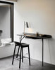 Woud Mono Counter Chair in seating, featuring a sleek, minimalist design with a wooden frame and modern aesthetic.