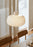 Woud Stone Pendant Glass lighting fixture hanging with a smooth stone-shaped glass shade and minimalist design.