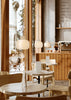 Woud Stone Pendant Glass lighting fixture hanging from ceiling, featuring a smooth stone-shaped glass shade with metal fittings.