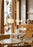 Woud Stone Pendant Glass lighting fixture hanging from ceiling, featuring a smooth stone-shaped glass shade with metal fittings.