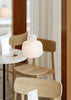 Woud Stone Pendant Glass lighting fixture hanging from ceiling with a smooth stone-shaped glass shade.