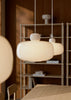Woud Stone Pendant Glass lighting fixture hanging with a smooth stone-inspired design and clear glass shade.
