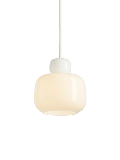 Small stone pendant glass lighting by Woud, featuring a clear glass shade with a smooth stone-like finish for modern decor.