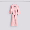 Pink waffle bathrobe by Hay, cozy and textured accessories with a soft, stylish appearance.