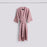 Pink waffle bathrobe by Hay with stripe design, cozy and lightweight accessories for comfortable lounging.