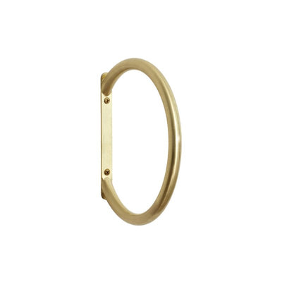Brass Apply Towel Ring by Hübsch mounted on wall, showcasing sleek accessory for bathroom or kitchen decor.