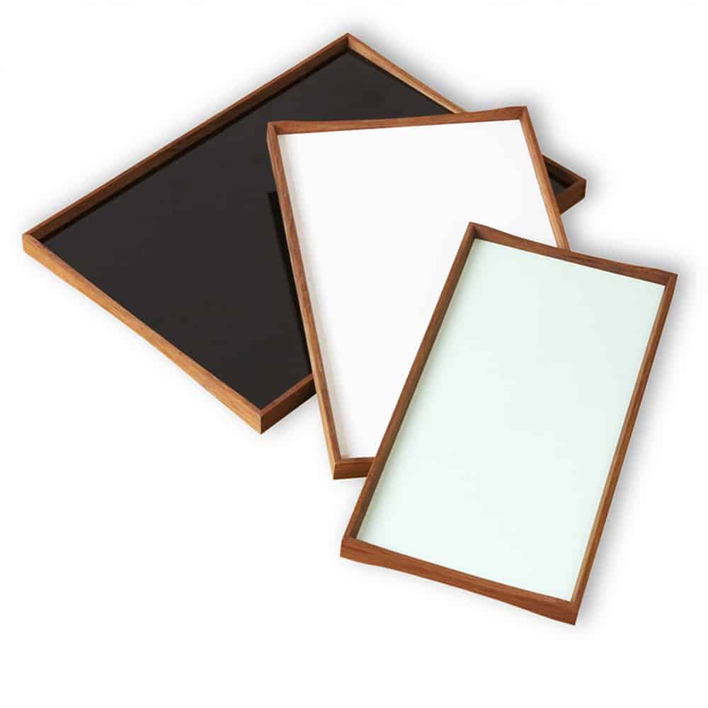 Black and blue small turning tray designed by Finn Juhl for Architectmade, showcasing a sleek, modern accessory with artistic craftsmanship.