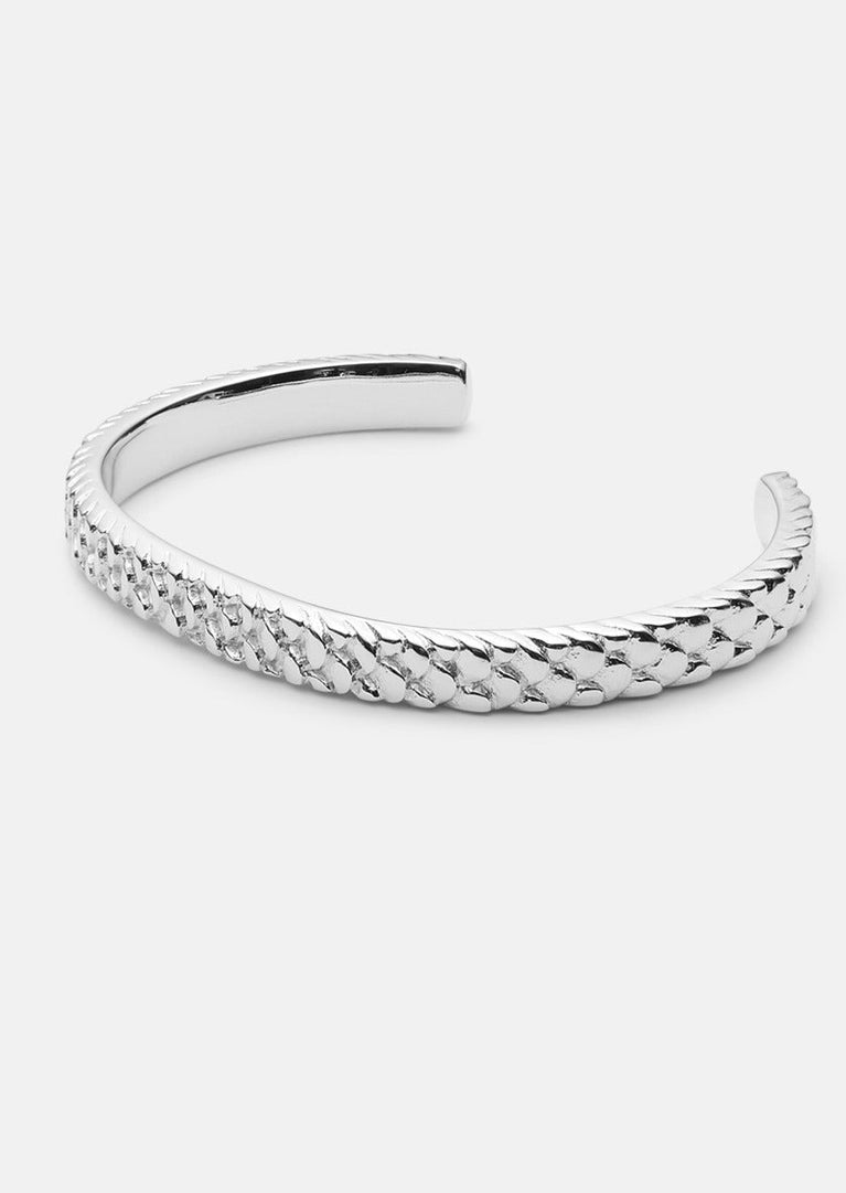 Silver plated Scale Cuff bracelet by Skultuna featuring a sleek, modern design on a neutral background.