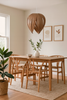 Red Birch Gladys Pendant light by Atelier Cocotte, featuring a large white shade and modern lighting design.
