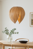 Red Birch Gladys Pendant light by Atelier Cocotte, showcasing a modern lighting fixture with a white interior and elegant design.