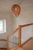 Gladys Pendant light by Atelier Cocotte featuring a large red and white birch wood design, modern lighting fixture.