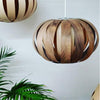 White Ruth small pendant light by Atelier Cocotte, featuring a minimalist oak and birch wood design for modern lighting.