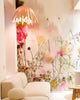White Tina Pendant light by Atelier Cocotte with a sleek, modern design, hanging from a ceiling fixture.