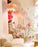 White Tina Pendant light by Atelier Cocotte with a sleek, modern design, hanging from a ceiling fixture.