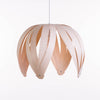Ti-Fleur pendant light by Atelier Cocotte featuring a walnut and white ceramic flower-shaped design for modern interior lighting.