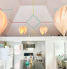 White birch Noisette #1 pendant light by Atelier Cocotte, showcasing a sleek, modern lighting fixture with a smooth, rounded design.