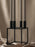 Black Kubus accessory by Audo Copenhagen, modern geometric design, made of sleek material, shown in a close-up image.