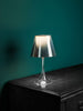Miss K by Flos lighting fixture with sleek base and modern design, showcasing its stylish metal finish and contemporary aesthetic.