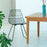 White Lucy Chair by Bend Goods, made in the USA, modern seating with a sleek, curved design for stylish home or office use.