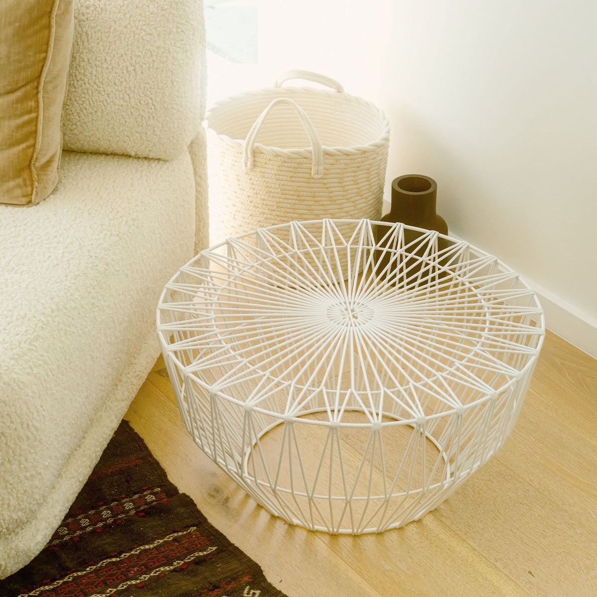 White Drum Table by Bend Goods, made in the USA, showcasing a modern design with a smooth, rounded surface and sturdy base.