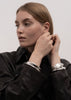 Silver-plated Écume De Mer Petit Bangle by Skultuna, delicate ocean-inspired jewelry accessory in a close-up view.