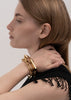 Gold plated Relier bracelet by Skultuna, elegant accessories with a sleek, polished design featuring a delicate chain and clasp.