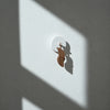 Birdie Pro accessories by Birdie featuring a walnut wall-mounted dead paddle for golf practice and training.