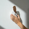 Birdie Pro accessories by Birdie, walnut wall mount with sleek design, perfect for organizing golf accessories or display.