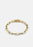 Gold plated Traverse Chain bracelet by Skultuna, showcasing a delicate chain design on a neutral background.