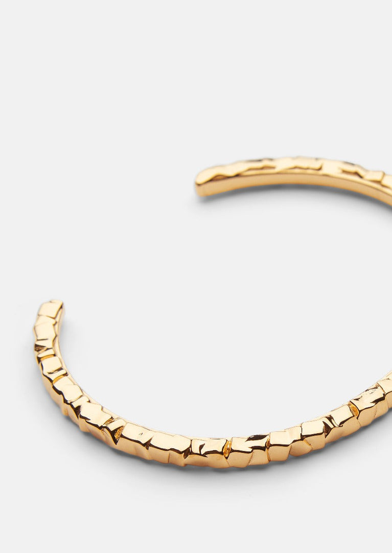 Gold-plated Morph Cuff Thin bracelet by Skultuna with sleek, minimalist design and subtle metallic shine.
