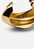 Gold-plated Écume De Mer bangle bracelet by Skultuna, featuring elegant, flowing design in a close-up shot.