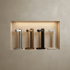 Set of four Stelton Brus Carbonator accessories in limewash finish, showcasing sleek, modern design for carbonating beverages.