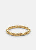 Gold plated Velo Chain bracelet by Skultuna featuring interlinked circular design, styled as a chic accessories piece.