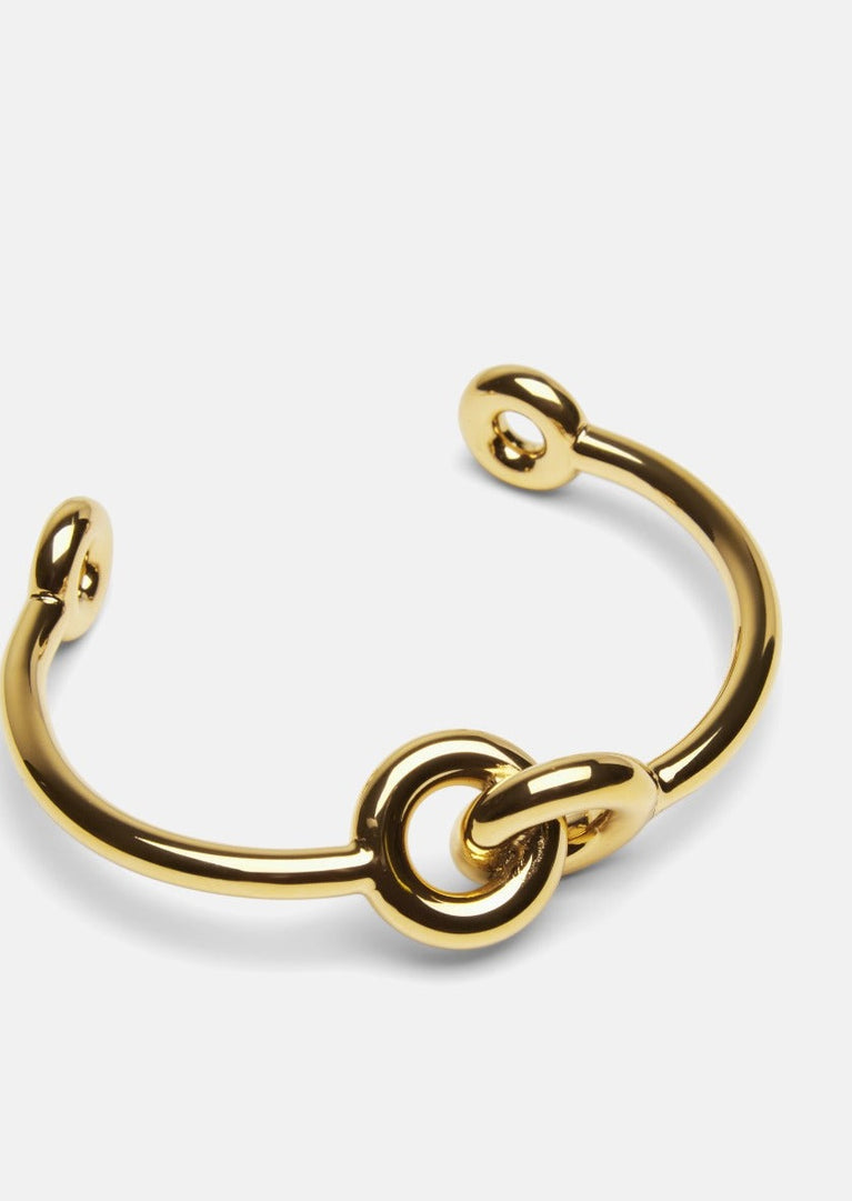 Gold plated Together Cuff bracelet by Skultuna, featuring a sleek, modern design in shining gold finish.