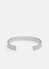 Silver plated ribbed cuff bracelet by Skultuna, showcasing textured design and polished finish on a neutral background.