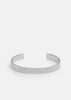 Silver plated ribbed cuff bracelet by Skultuna, featuring textured design and polished finish, shown on a neutral background.