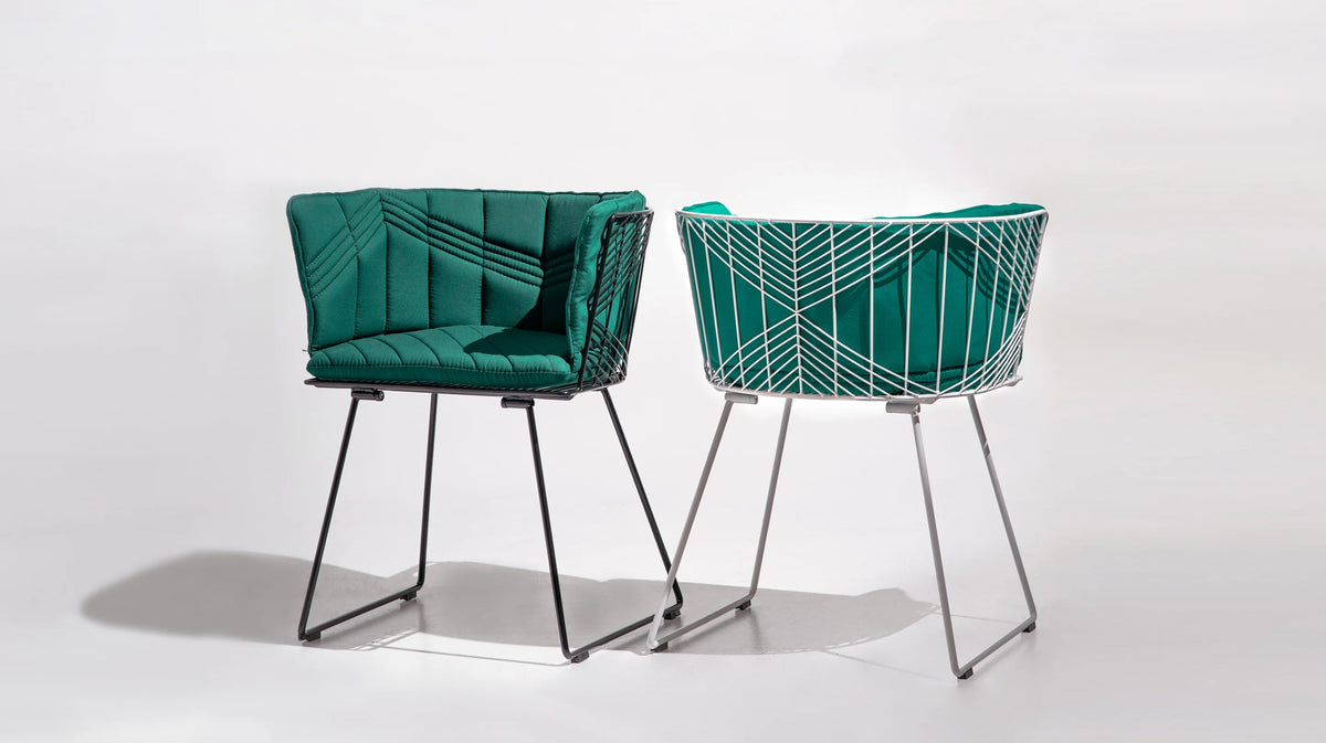 Bend Goods Captain Wire Chair in black with a curved metal frame and woven wire seat, modern seating for indoor or outdoor use.