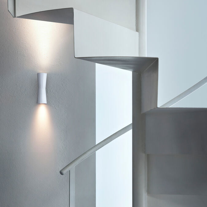 White Clessidra wall and ceiling lamp by Flos, featuring sleek modern lighting design with a minimalist aesthetic.