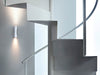 White Clessidra wall and ceiling lamp by Flos, sleek modern lighting fixture with minimalist design and smooth surface.
