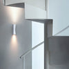 White Clessidra wall and ceiling lamp by Flos, featuring sleek modern lighting design with a minimalist aesthetic.