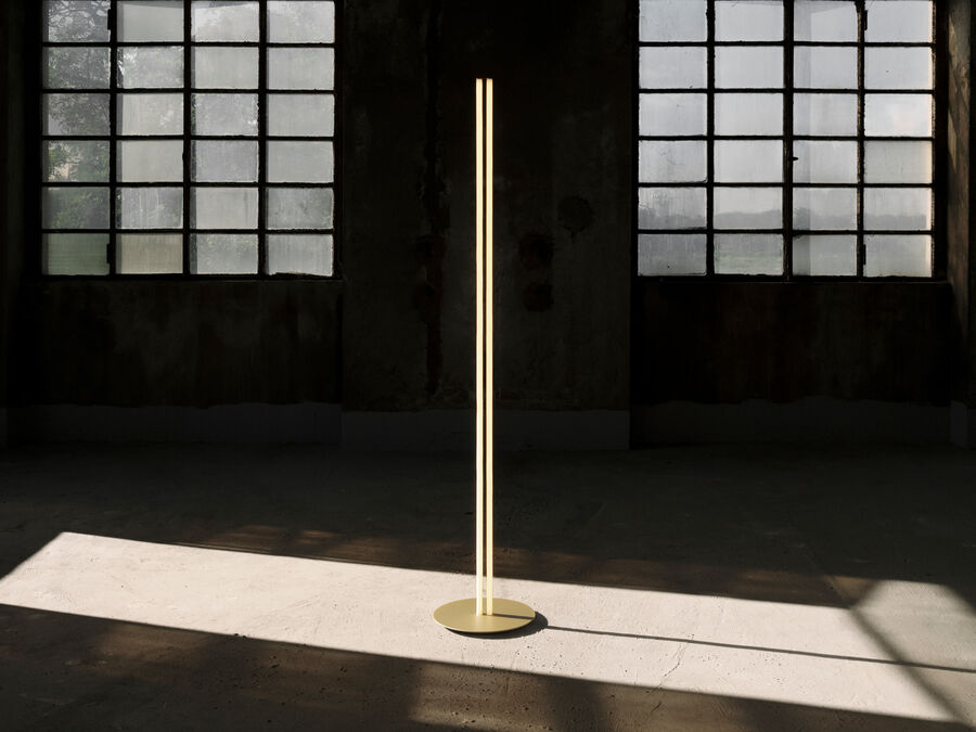 Coordinates Floor lamp by Flos in champagne finish with sleek, modern design and adjustable lighting features.