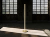 Coordinates Floor lamp by Flos in champagne finish with sleek, modern design and adjustable lighting features.