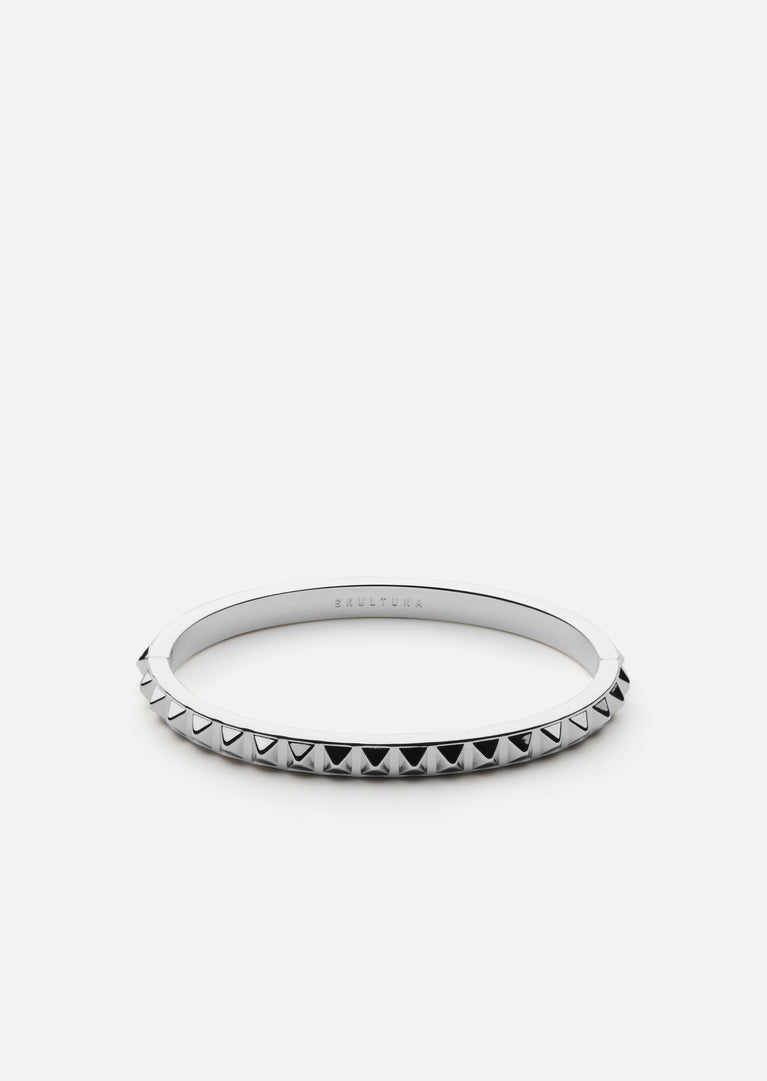 Silver plated Rivets Bangle by Skultuna, a sleek accessory with a modern cuff design, shown from the back view.