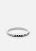 Silver plated Rivets Bangle by Skultuna, a sleek accessory with a modern cuff design, shown from the back view.