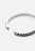 Silver plated Rivets Bangle by Skultuna, close-up of sleek, minimalist jewelry accessory with rivet details on a plain background.