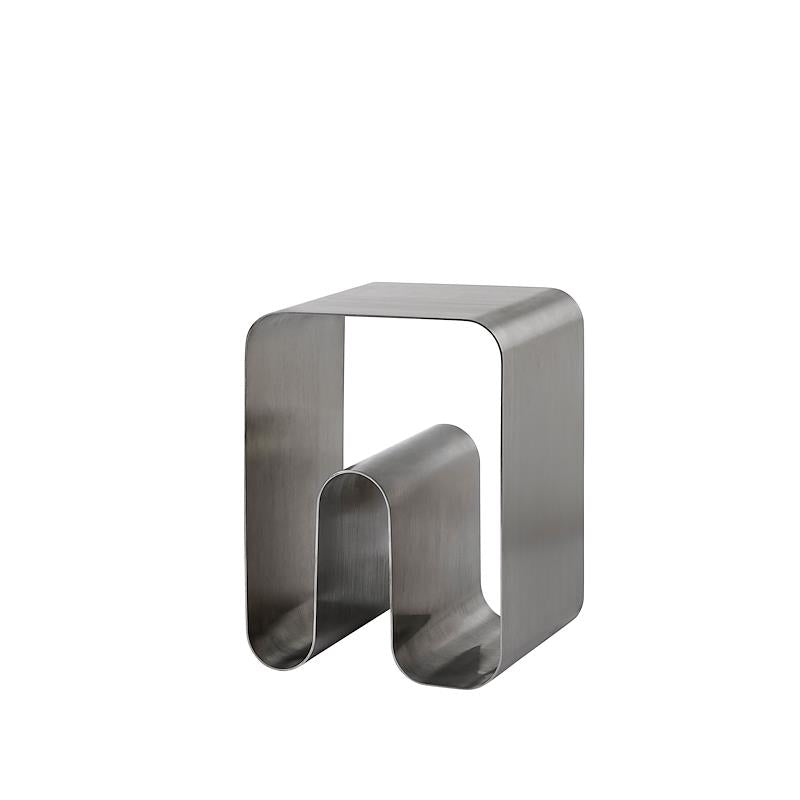 AYTM Curva Solid Stool showcasing smooth, curved design with wooden legs and a sleek, minimalist seating surface.