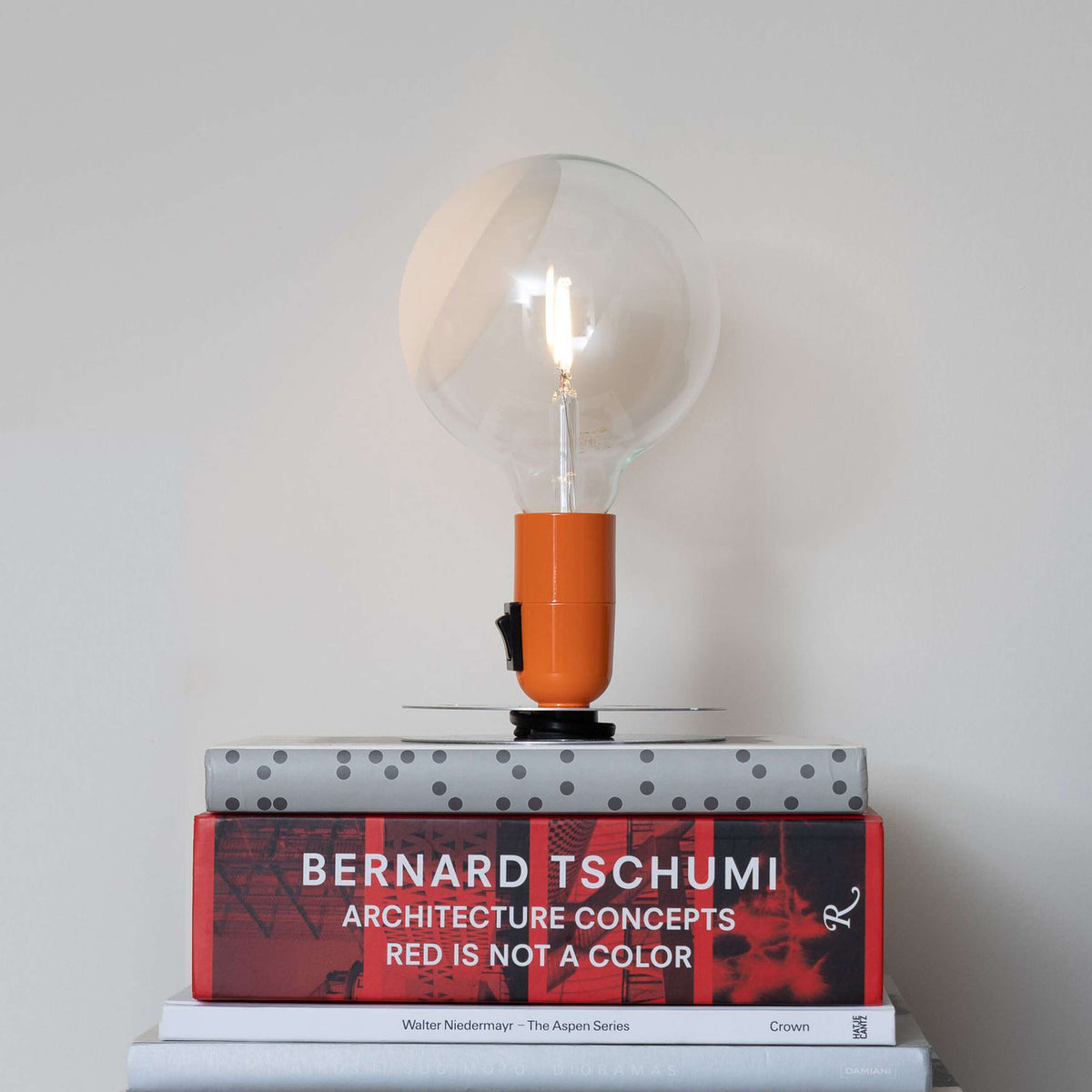 Illuminated Flos Lampadina lighting bulb with sleek design, showcasing the modern, minimalist style of the Flos lighting collection.