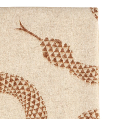Soft Eden Merino Wool Throw by Jonathan Adler draped over a bed, showcasing its cozy, luxurious texture and elegant design.