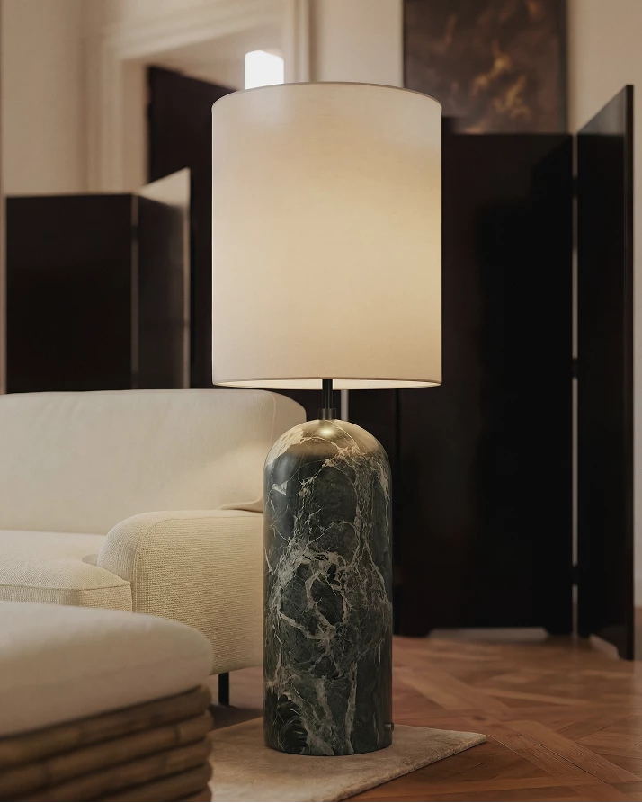 Elegant XL Gravity Floor Lamp by Gubi featuring a sleek, sculptural design with a tall, curved metal stand and modern lighting fixture.