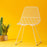 Ethel Chair by Bend Goods featuring a modern, open metal frame with a sleek, minimalist design for stylish seating.